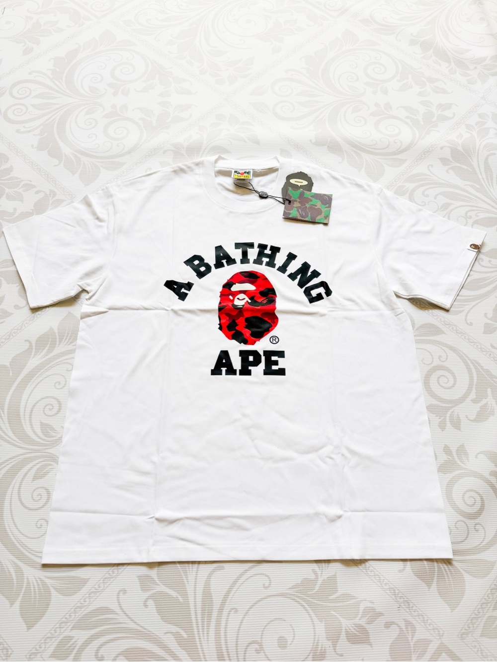 A Bathing Ape White Tee with Red Camo Ape Logo